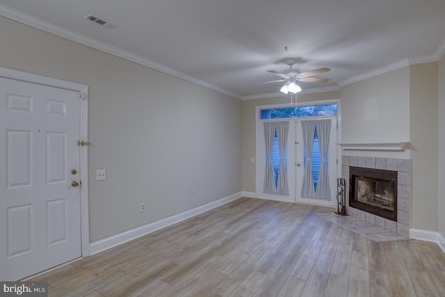 2902 Waters Edge Dr Unit 261, Newark, DE 19702 - unfurnished living room featuring ceiling fan, ornamental molding, light wood-style floors, and a fireplace