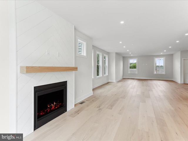 738 S Matlack St, West Chester, PA 19382 - unfurnished living room with recessed lighting, a fireplace, and wood finished floors