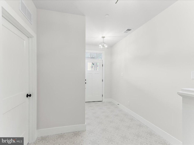 738 S Matlack St, West Chester, PA 19382 - hall featuring a chandelier and speckle patterned floor