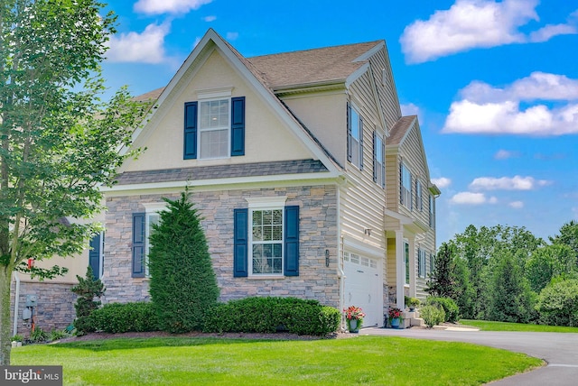 3017 Bainbridge Dr, Lansdale, PA 19446 - view of front facade featuring stone siding, a garage, a front yard, and concrete driveway