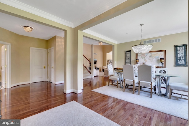 3017 Bainbridge Dr, Lansdale, PA 19446 - dining room featuring wood finished floors, stairway, a chandelier, and ornamental molding