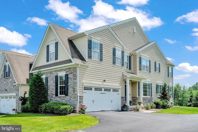 3017 Bainbridge Dr, Lansdale, PA 19446 - view of front facade featuring stone siding, driveway, an attached garage, and a front lawn
