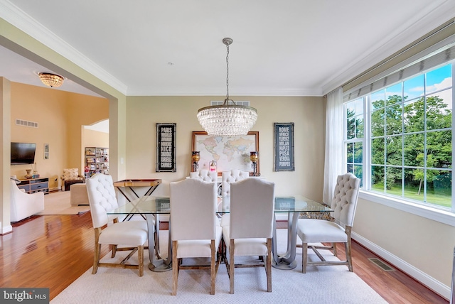 3017 Bainbridge Dr, Lansdale, PA 19446 - dining space featuring wood finished floors, crown molding, and a chandelier