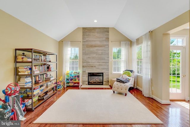 3017 Bainbridge Dr, Lansdale, PA 19446 - sitting room with wood finished floors, a large fireplace, and lofted ceiling