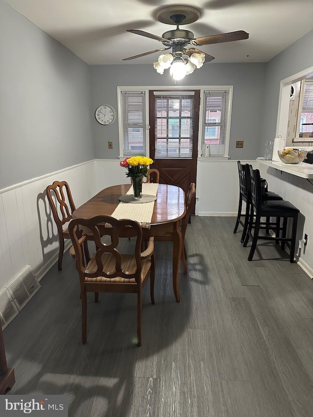 3432 Hartel Ave, Philadelphia, PA 19136 - dining area with ceiling fan, dark wood-style flooring, and wainscoting