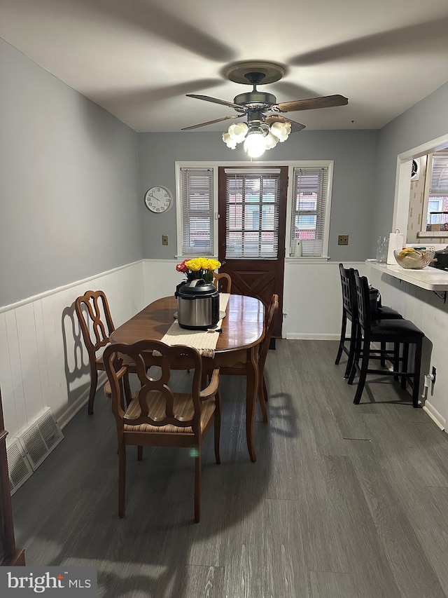 3432 Hartel Ave, Philadelphia, PA 19136 - dining room with ceiling fan, dark wood-style floors, and a wainscoted wall