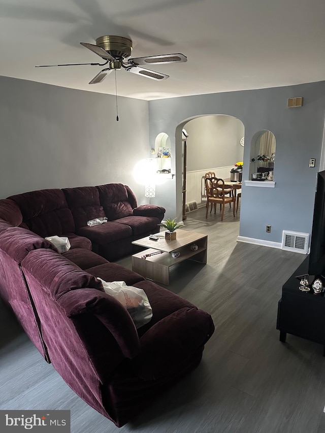 3432 Hartel Ave, Philadelphia, PA 19136 - living area with arched walkways, a ceiling fan, and wood finished floors