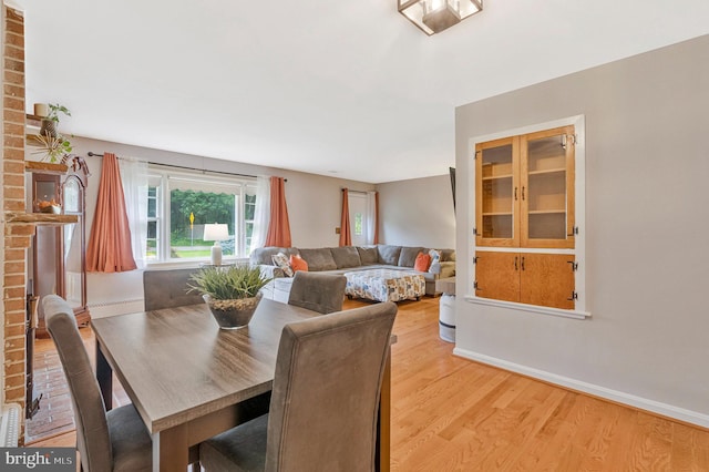29 Cedar Dr, Sterling, VA 20164 - dining room with light wood-type flooring and baseboards