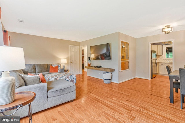 29 Cedar Dr, Sterling, VA 20164 - living room featuring light wood-type flooring and baseboards
