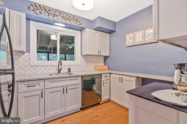 29 Cedar Dr, Sterling, VA 20164 - kitchen featuring dishwasher, light wood finished floors, decorative backsplash, white cabinetry, and freestanding refrigerator