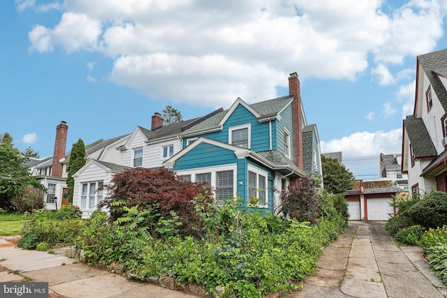 114 Walsh Rd, Lansdowne, PA 19050 - view of front of home featuring a garage and a chimney