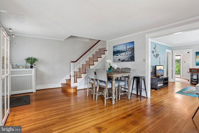 114 Walsh Rd, Lansdowne, PA 19050 - dining space with ornamental molding, stairs, and hardwood / wood-style flooring