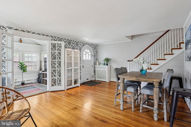 114 Walsh Rd, Lansdowne, PA 19050 - dining room with hardwood / wood-style flooring, stairway, baseboard heating, and french doors