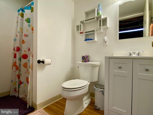 2634 Yorkway, Baltimore, MD 21222 - bathroom featuring vanity, wood finished floors, and a shower with curtain