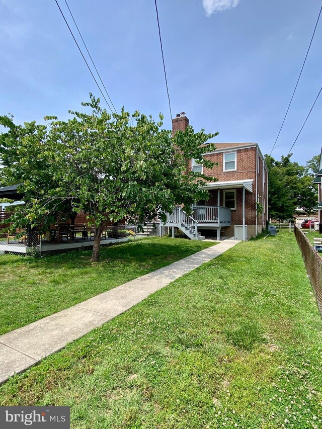 2634 Yorkway, Baltimore, MD 21222 - view of front facade with a chimney, brick siding, and covered porch