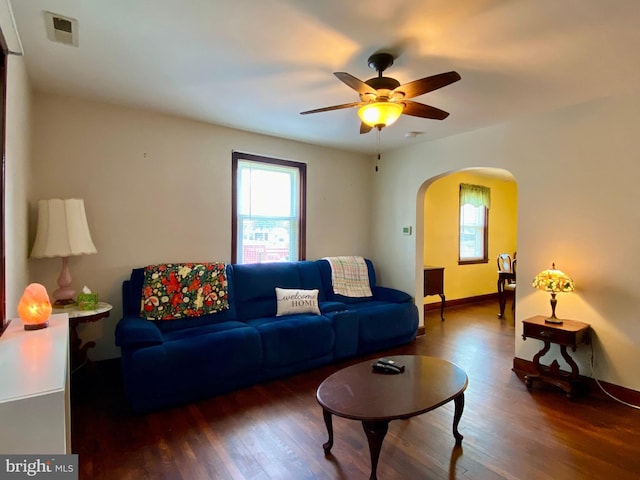 2634 Yorkway, Baltimore, MD 21222 - living room featuring arched walkways, wood finished floors, and a ceiling fan