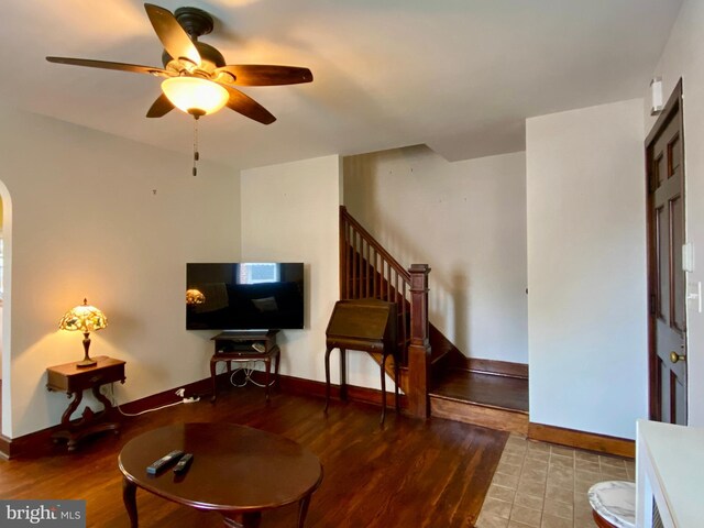 2634 Yorkway, Baltimore, MD 21222 - living room featuring a ceiling fan, wood finished floors, arched walkways, and stairway