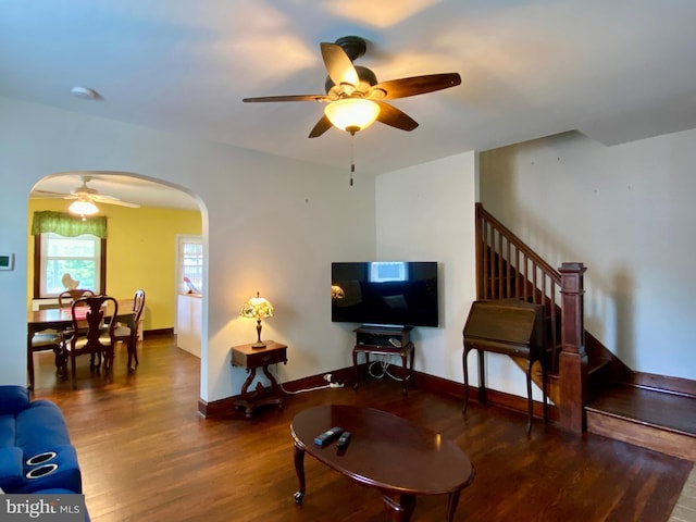 2634 Yorkway, Baltimore, MD 21222 - living room featuring a ceiling fan, arched walkways, wood finished floors, and stairs