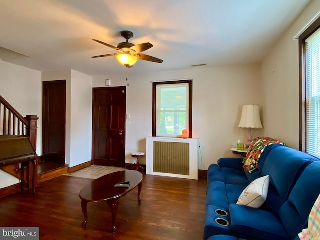 2634 Yorkway, Baltimore, MD 21222 - living area with radiator heating unit, wood finished floors, ceiling fan, and stairway