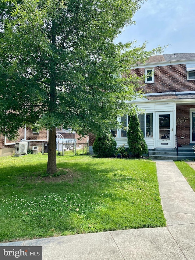 2634 Yorkway, Baltimore, MD 21222 - view of front of home featuring brick siding and a front yard