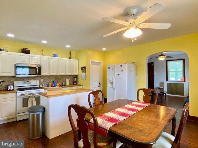 2634 Yorkway, Baltimore, MD 21222 - dining room with a ceiling fan, arched walkways, dark wood-type flooring, and recessed lighting