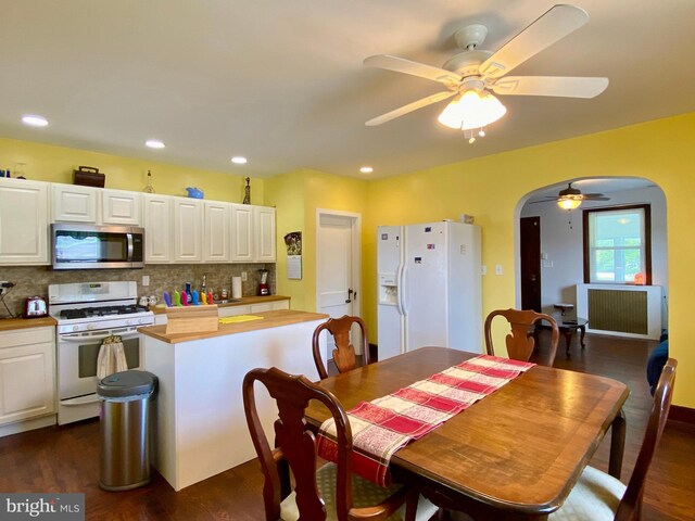 2634 Yorkway, Baltimore, MD 21222 - dining space featuring arched walkways, a ceiling fan, dark wood-type flooring, and recessed lighting