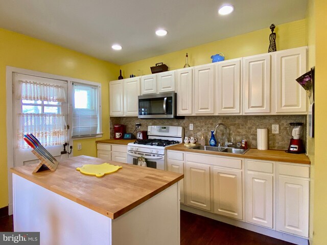 2634 Yorkway, Baltimore, MD 21222 - kitchen featuring stainless steel microwave, butcher block countertops, white range with gas stovetop, white cabinets, and recessed lighting