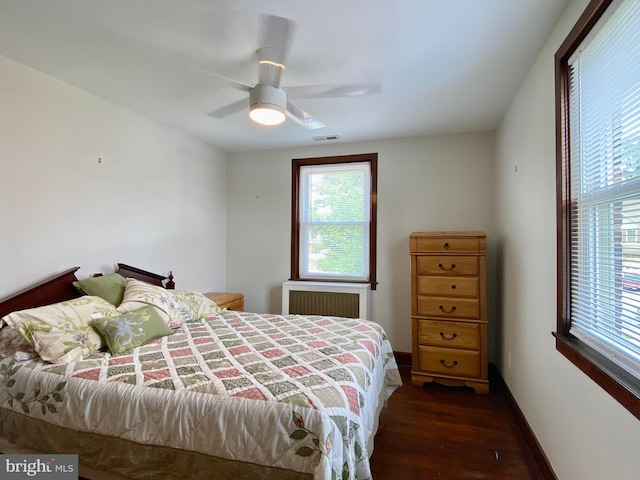 2634 Yorkway, Baltimore, MD 21222 - bedroom with wood finished floors, multiple windows, ceiling fan, and radiator heating unit