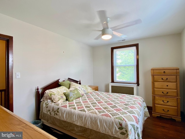 2634 Yorkway, Baltimore, MD 21222 - bedroom with radiator, wood finished floors, and a ceiling fan
