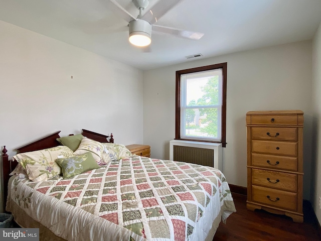 2634 Yorkway, Baltimore, MD 21222 - bedroom with radiator heating unit, wood finished floors, and a ceiling fan