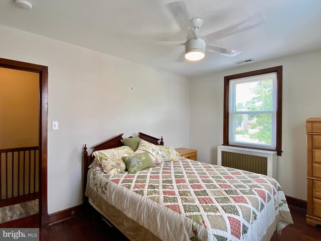 2634 Yorkway, Baltimore, MD 21222 - bedroom featuring radiator, wood finished floors, and ceiling fan