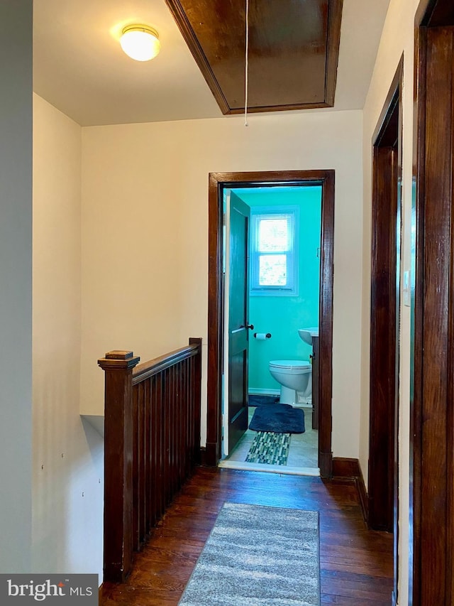 2634 Yorkway, Baltimore, MD 21222 - hallway with attic access, dark wood-style floors, and an upstairs landing