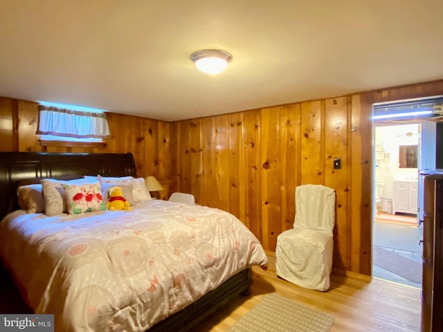 2634 Yorkway, Baltimore, MD 21222 - bedroom featuring light wood-style floors and wooden walls