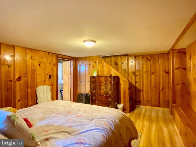 2634 Yorkway, Baltimore, MD 21222 - bedroom featuring light wood finished floors and wood walls