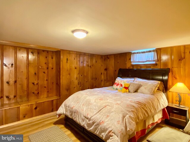 2634 Yorkway, Baltimore, MD 21222 - bedroom featuring wood finished floors and wooden walls