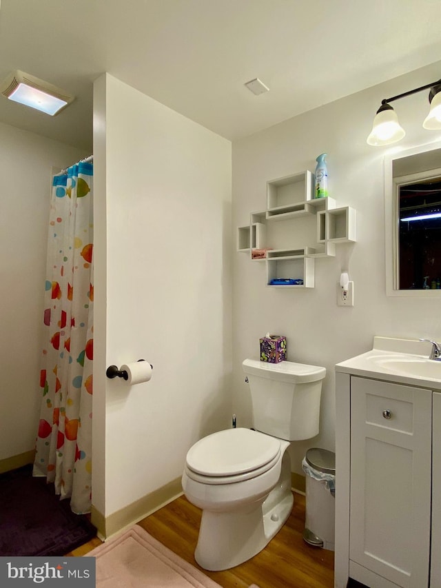 2634 Yorkway, Baltimore, MD 21222 - bathroom with wood finished floors, vanity, and curtained shower