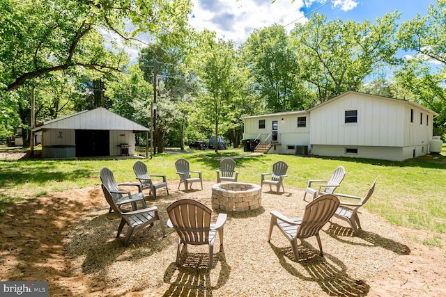 1945 Shenandoah Springs Ln, Elkton, VA 22827 - view of grassy yard featuring an outdoor fire pit and view of wooded area