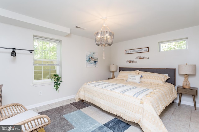 1945 Shenandoah Springs Ln, Elkton, VA 22827 - bedroom featuring a chandelier, tile patterned floors, and multiple windows