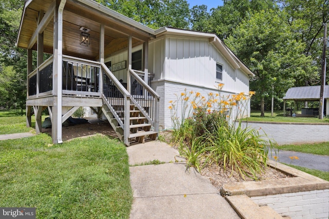 1945 Shenandoah Springs Ln, Elkton, VA 22827 - view of front of house featuring stairway, board and batten siding, and a front yard