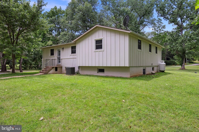 1945 Shenandoah Springs Ln, Elkton, VA 22827 - view of side of home with board and batten siding and a yard