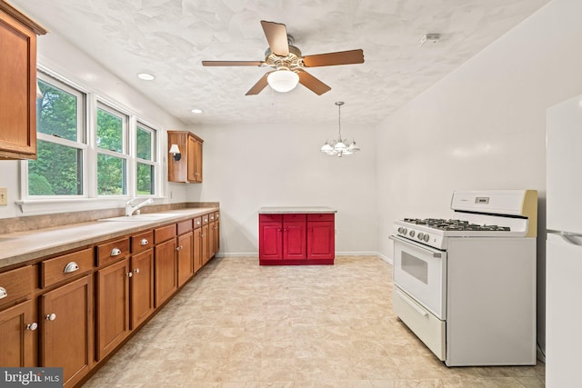 421 Old Stage Rd, Lewisberry, PA 17339 - kitchen featuring white appliances, brown cabinets, a ceiling fan, a chandelier, and hanging light fixtures