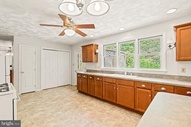 421 Old Stage Rd, Lewisberry, PA 17339 - kitchen with white appliances, ceiling fan, brown cabinetry, and recessed lighting