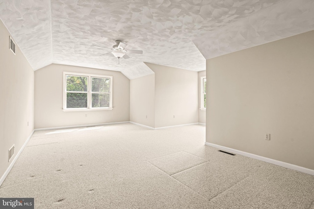 421 Old Stage Rd, Lewisberry, PA 17339 - additional living space with healthy amount of natural light, ceiling fan, a textured ceiling, vaulted ceiling, and carpet flooring