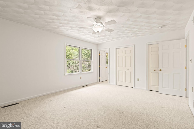 421 Old Stage Rd, Lewisberry, PA 17339 - unfurnished bedroom with carpet, two closets, and ceiling fan