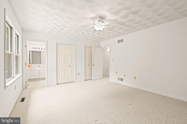 421 Old Stage Rd, Lewisberry, PA 17339 - unfurnished bedroom with multiple closets, carpet flooring, ensuite bathroom, and multiple windows