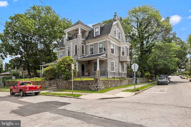 400 E Vernon Rd, Philadelphia, PA 19119 - view of front of home featuring a chimney, mansard roof, and a shingled roof