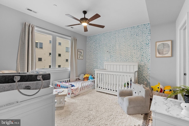 1837 N Palethorp St, Philadelphia, PA 19122 - bedroom featuring wallpapered walls, carpet floors, an accent wall, and a ceiling fan