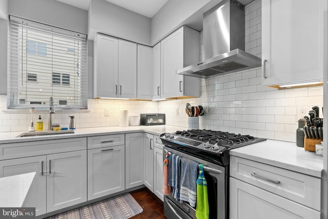 1837 N Palethorp St, Philadelphia, PA 19122 - kitchen featuring wall chimney range hood, gas range, decorative backsplash, and dark wood-style floors