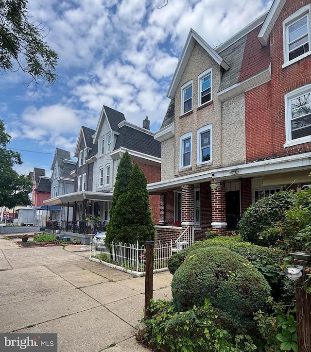 6221 Chew Ave, Philadelphia, PA 19138 - view of front of house with brick siding, covered porch, and a residential view