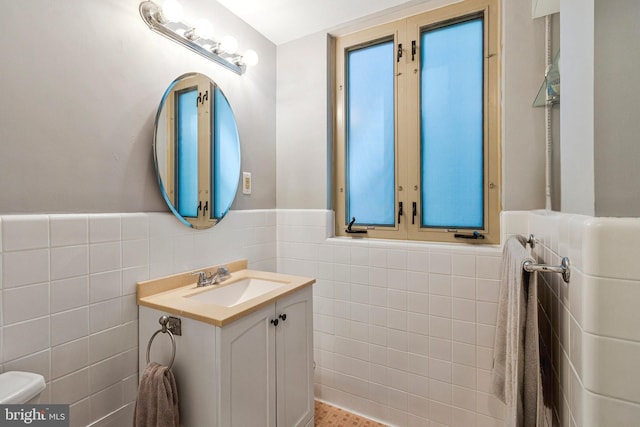 4301 Massachusetts Ave NW Unit A212, Washington, DC 20016 - bathroom with tile walls, vanity, and wainscoting